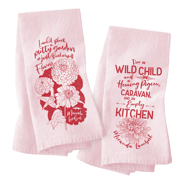 Tea towels. Front 1: "I could plant a pretty garden or just send myself flowers, Miranda Lambert." Front 2: "I'm wild child and a homing pigeon, caravan and an empty kitchen, Miranda Lambert."